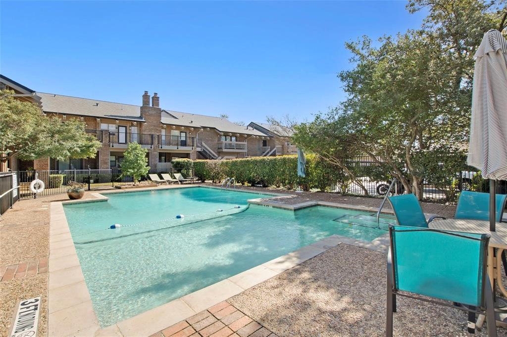 10755 Villager Road, Unit B Dallas, TX 75230 - Photo 22 of 24 a view of a street with a building and a fire pit