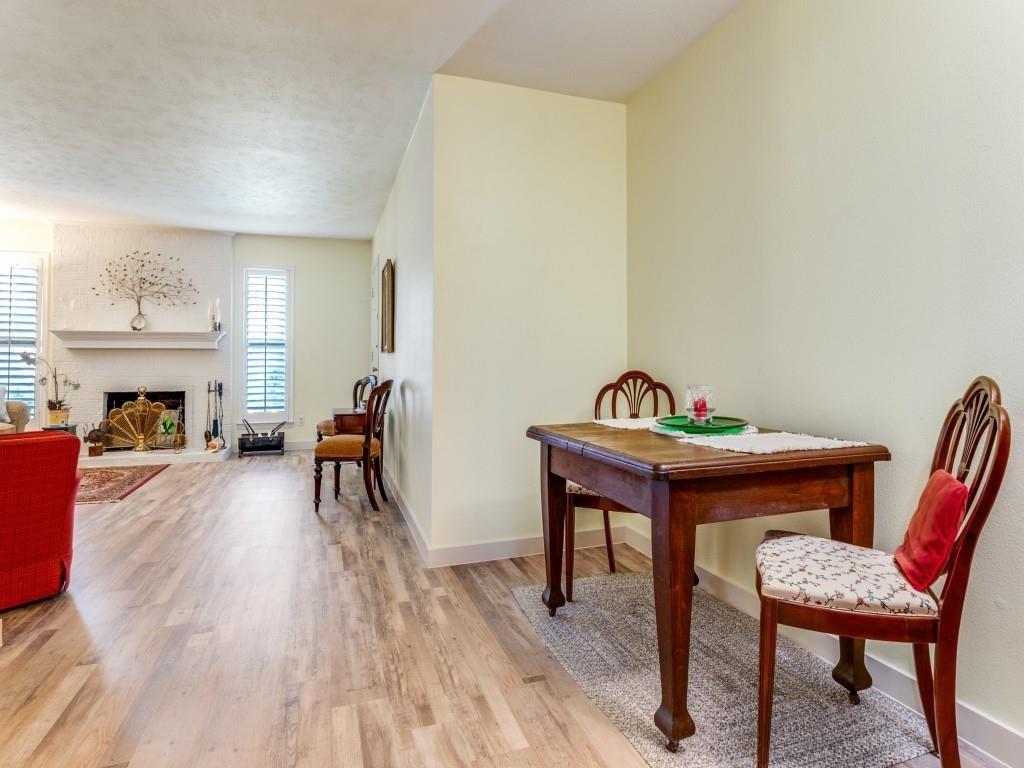 10755 Villager Road, Unit B Dallas, TX 75230 - Photo 4 of 24 a living room with furniture and a fireplace