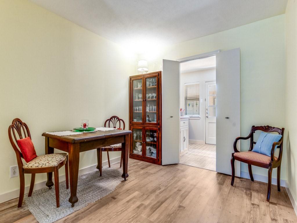 10755 Villager Road, Unit B Dallas, TX 75230 - Photo 5 of 24 a living room with furniture and wooden floor
