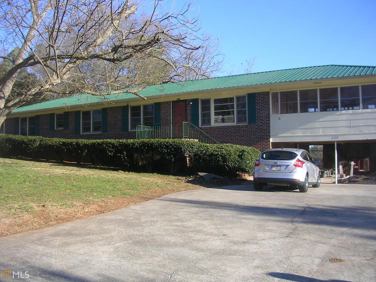 628 Collard Valley Road, Unit 7 Cedartown, GA 30125 - Photo 1 of 1 a front view of a house with garden