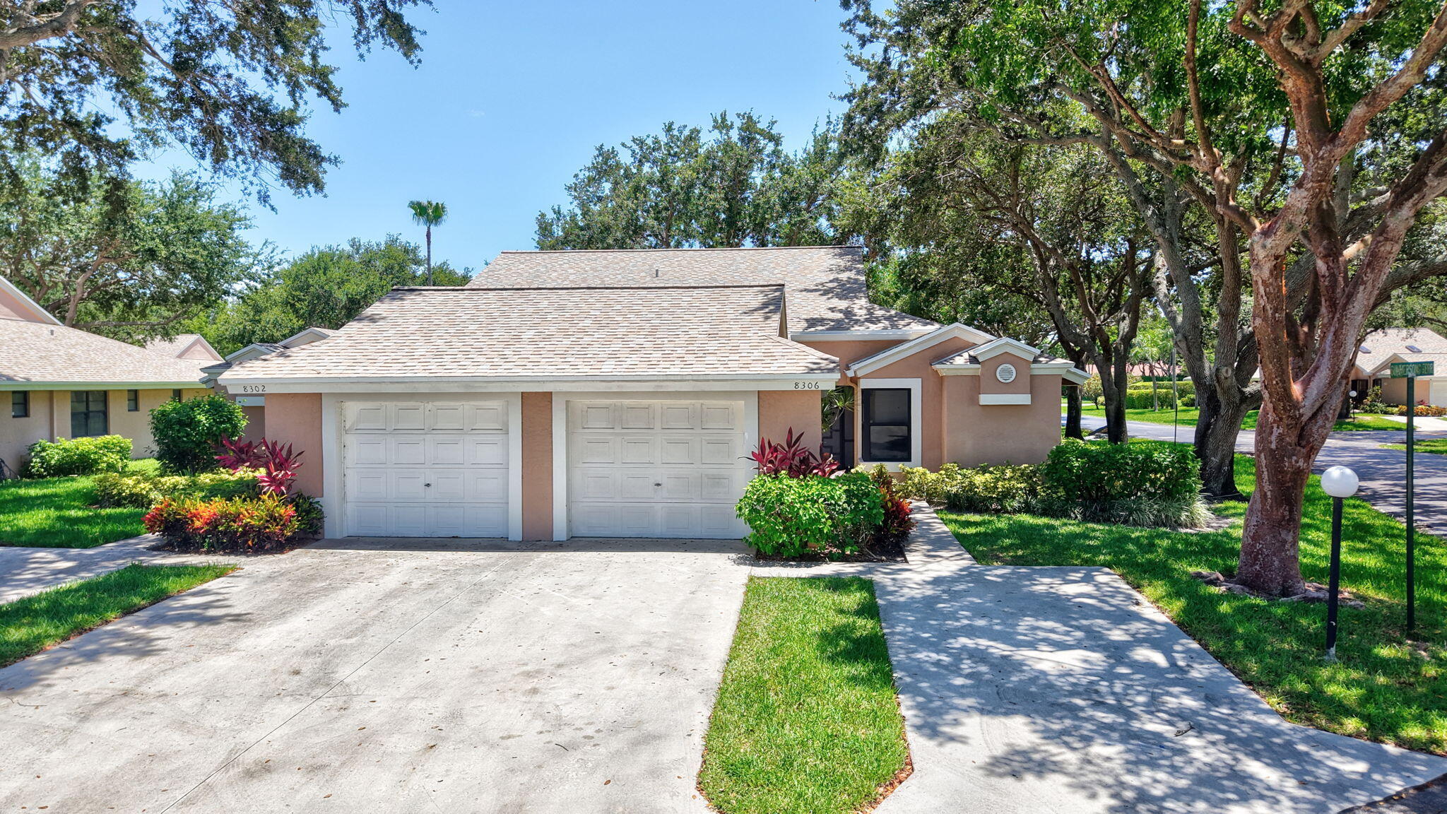 8306 Summersong Terrace Boca Raton, FL 33496 - Photo 3 of 51 a front view of a house with a yard and garage