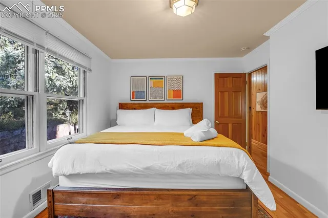 a bedroom with a bed and window