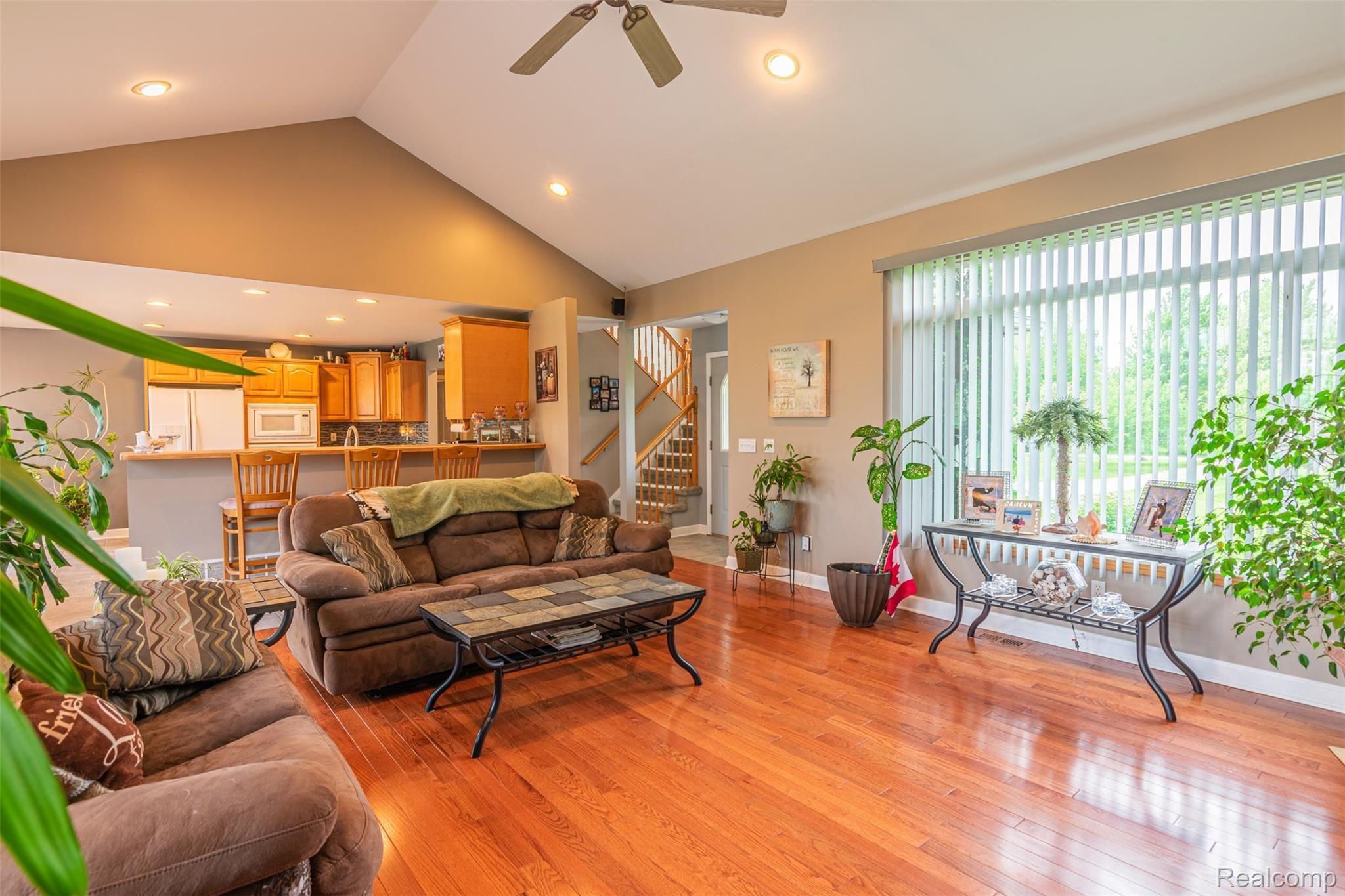 10151 Meskill Road Columbus, MI 48063 - Photo 5 of 39 Open-concept living room and kitchen area - great for entertaining! This all connects to the expansive back deck, creating a great indoor-outdoor space!
