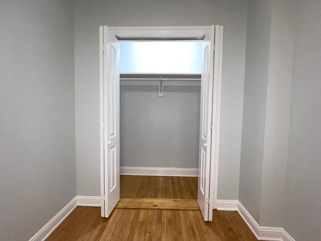 a kitchen with stainless steel appliances a refrigerator and a stove top oven