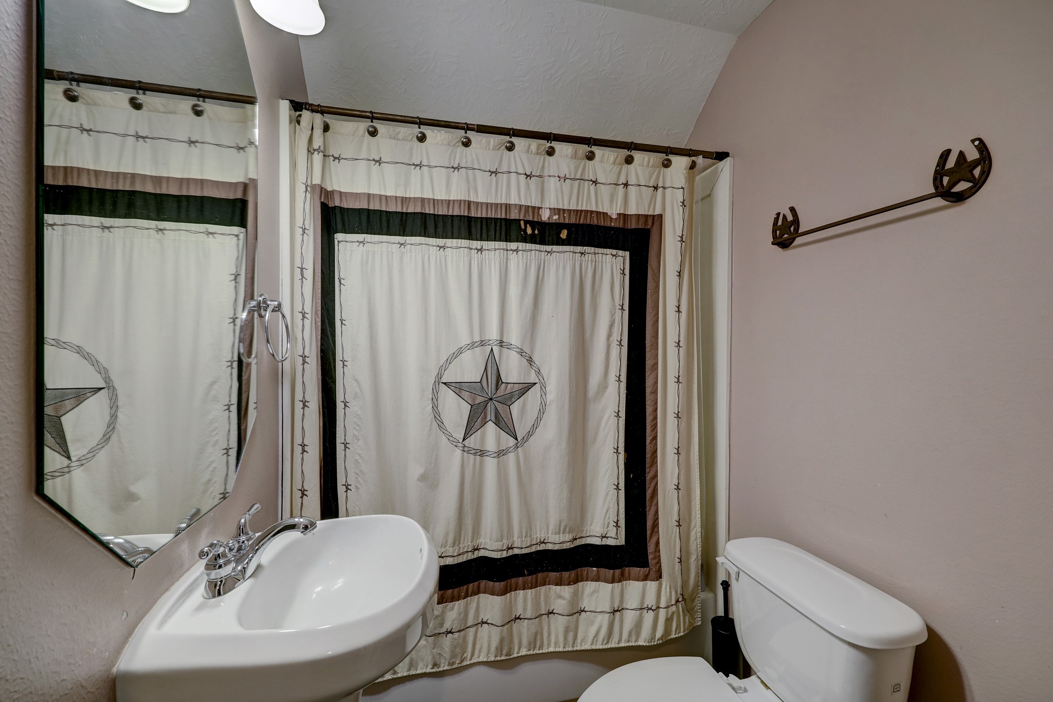 2949 Hargraves Road Huffman, TX 77336 - Photo 15 of 34 a bathroom with a toilet sink and shower