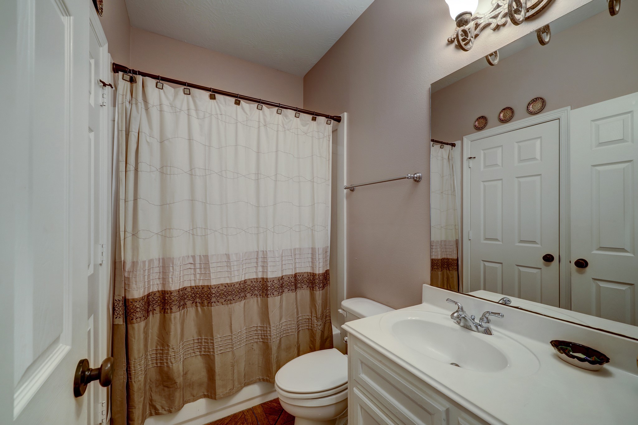 2949 Hargraves Road Huffman, TX 77336 - Photo 17 of 34 a bathroom with a sink toilet and shower