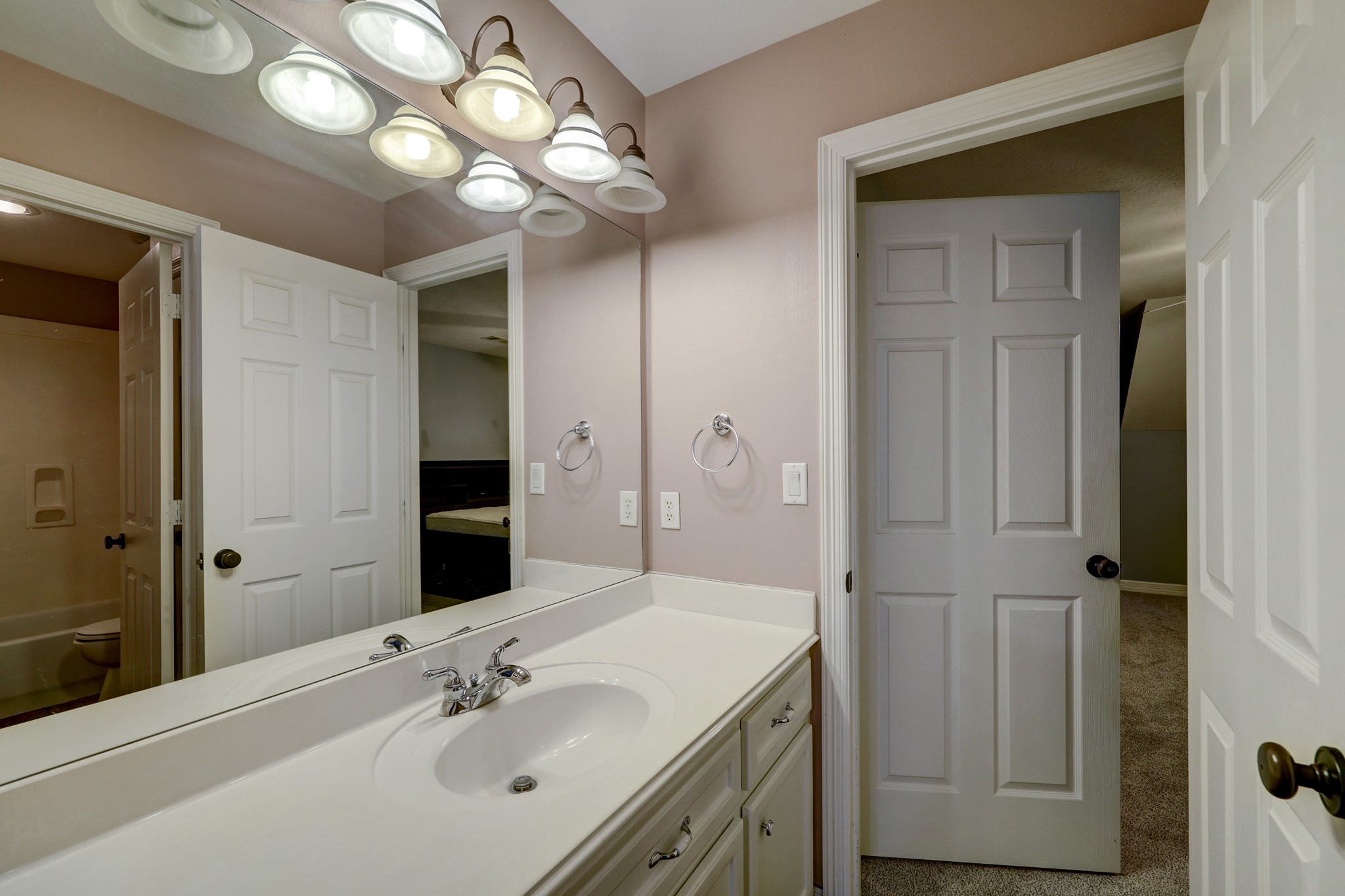 2949 Hargraves Road Huffman, TX 77336 - Photo 20 of 34 a bathroom with a sink vanity and a mirror