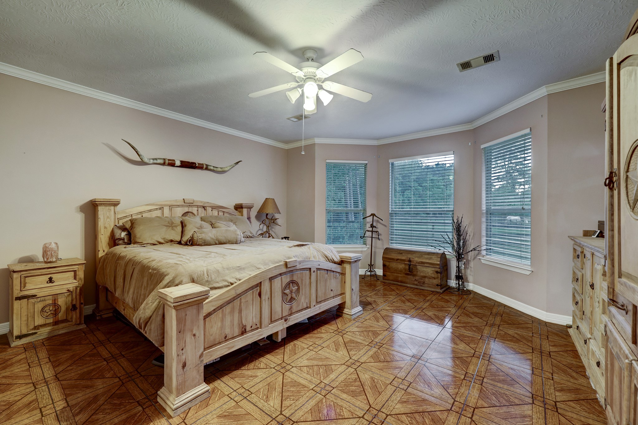 2949 Hargraves Road Huffman, TX 77336 - Photo 10 of 34 a spacious bedroom with a bed and a chandelier