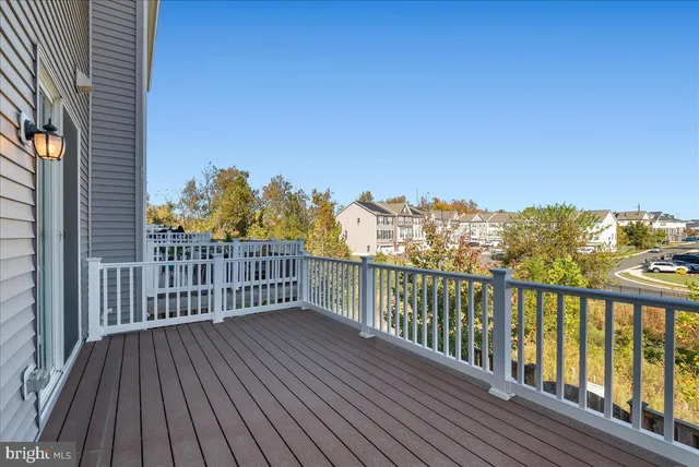 a view of a balcony with wooden floor
