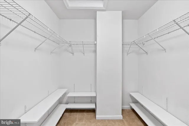 a bathroom with a double vanity sink mirror and shower