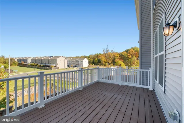 a view of a balcony with wooden floor