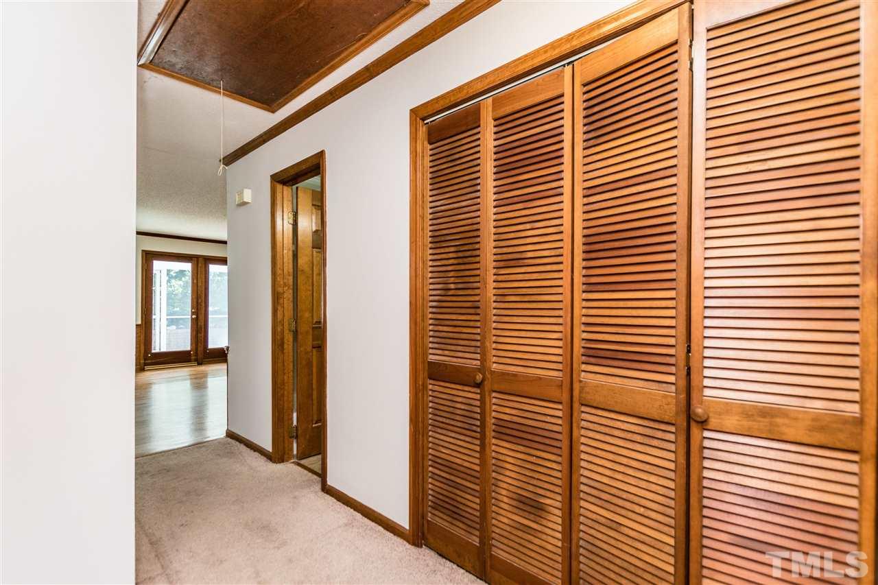 2830 Sterling Park Drive Raleigh, NC 27603 - Photo 12 of 23 CONVENIENT HALLWAY LAUNDRY ROOM WITH MATCHING WOODEN DOORS!