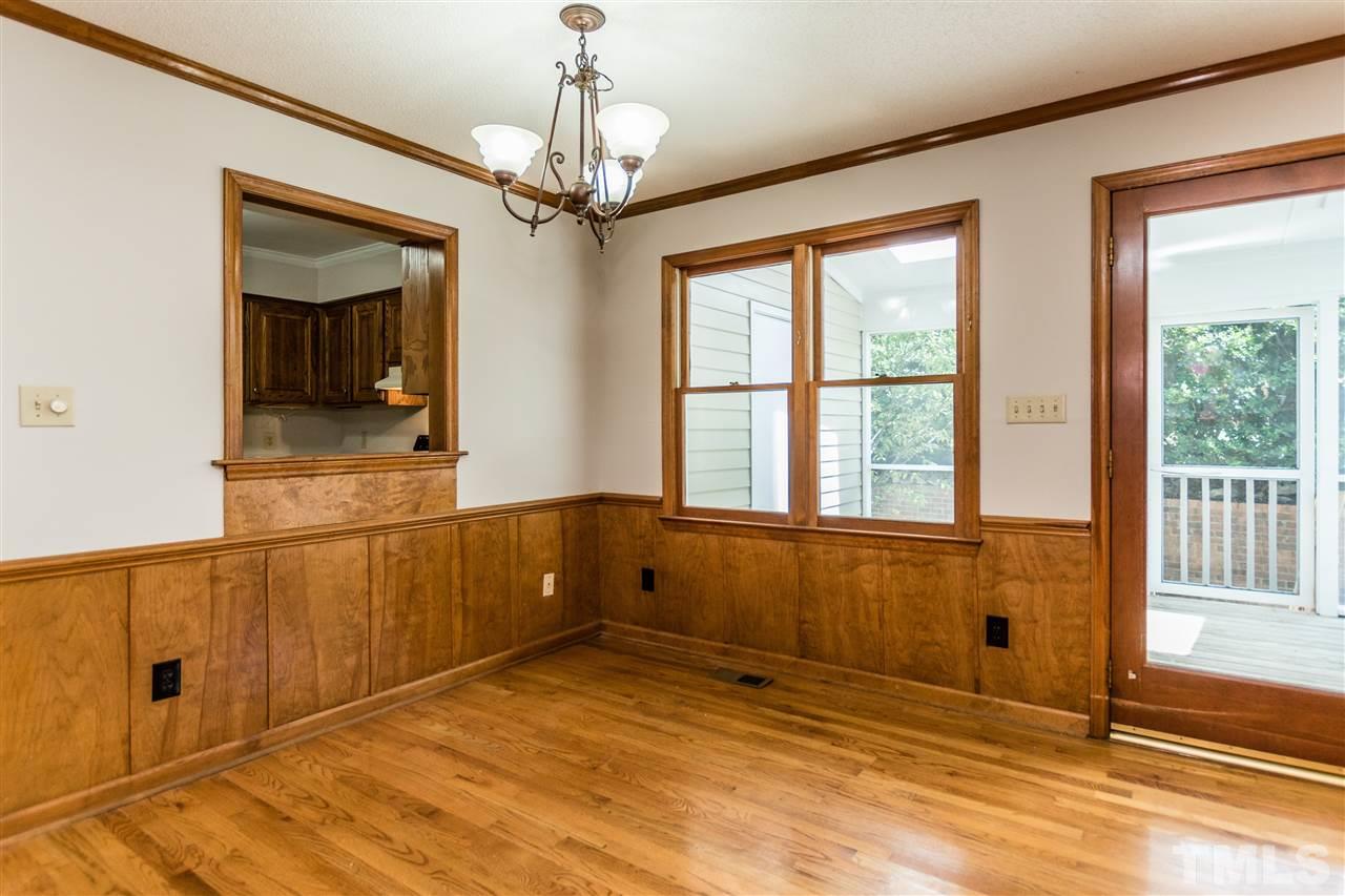 2830 Sterling Park Drive Raleigh, NC 27603 - Photo 7 of 23 BEAUTIFUL HARDWOODS AND DOORWAY LEADING TO THE FRESHLY PAINTED LARGE SCREENED IN PORCH!