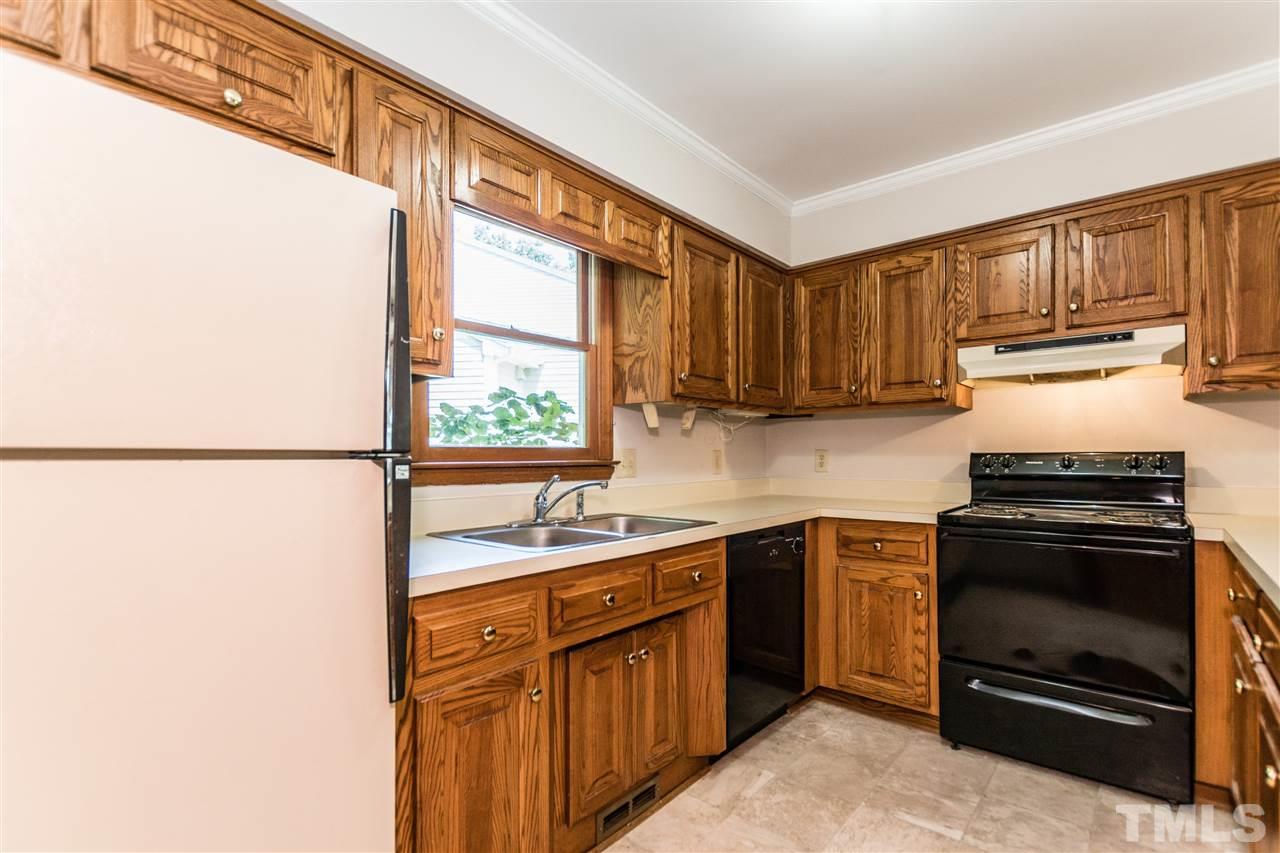 2830 Sterling Park Drive Raleigh, NC 27603 - Photo 8 of 23 HARDWOOD CABINETS PROVIDE LOTS OF KITCHEN STORAGE!