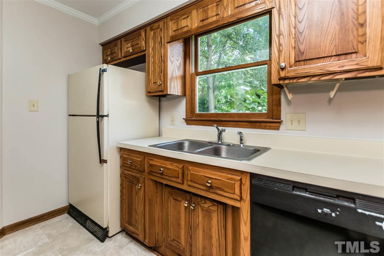 2830 Sterling Park Drive Raleigh, NC 27603 - Photo 10 of 23 ALL APPLIANCES CONVEY AND WINDOW ABOVE SINK ALLOWS FOR GREAT OUTDOOR VIEWS!