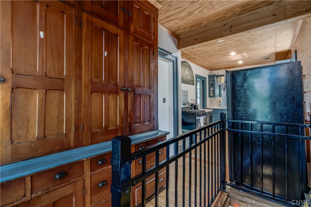 930 State Street Wilna, NY 13619 - Photo 8 of 38 Kitchen storage and stairs leading to basement.