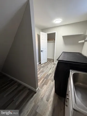 a view of room with window and stairs