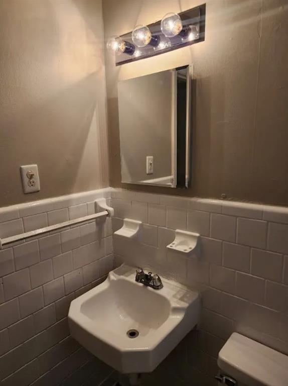 460 Main Street Forest Park, GA 30297 - Photo 7 of 10 a bathroom with a sink and a mirror