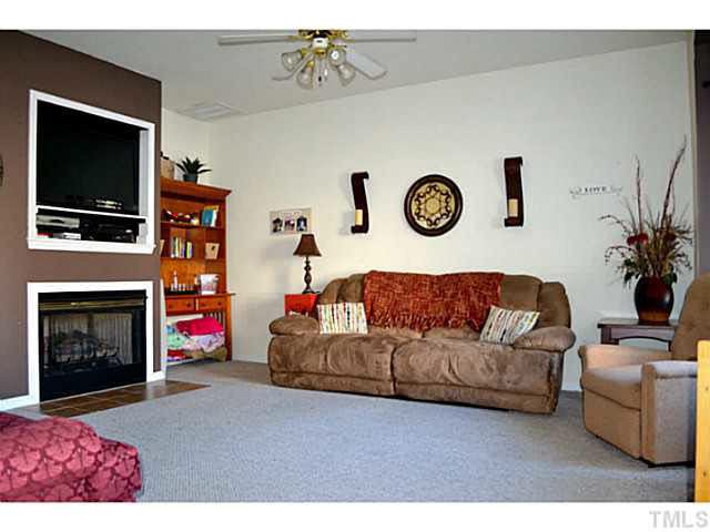 249 Dairy Road Clayton, NC 27520 - Photo 3 of 24 Open Family room with gas-log fireplace, TV niche... Den/Family/Great Room