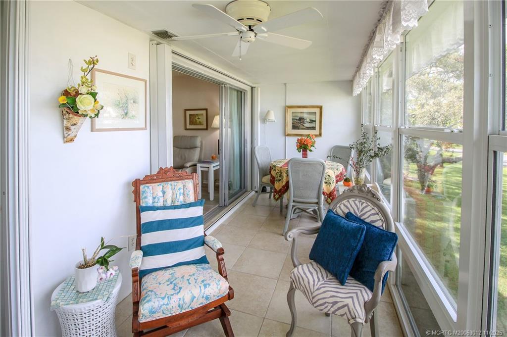 2929 Southeast Ocean Boulevard, Unit 1189 Stuart, FL 34996 - Photo 22 of 34 a living room with furniture and a window