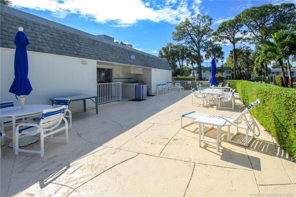 2929 Southeast Ocean Boulevard, Unit 1189 Stuart, FL 34996 - Photo 29 of 34 a view of a backyard with sitting area
