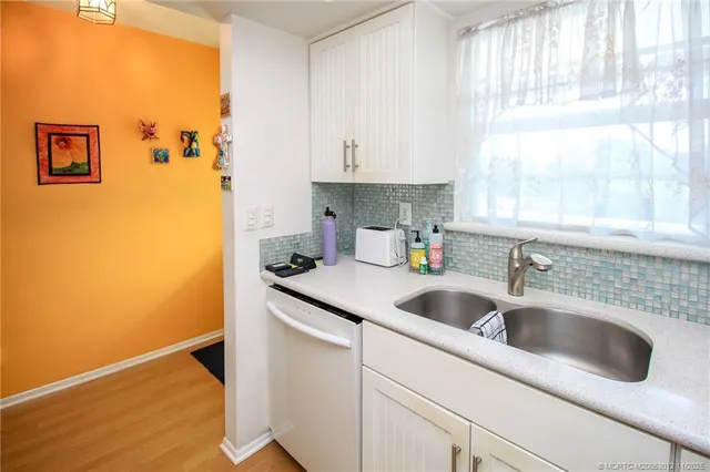 a kitchen with a sink and cabinets