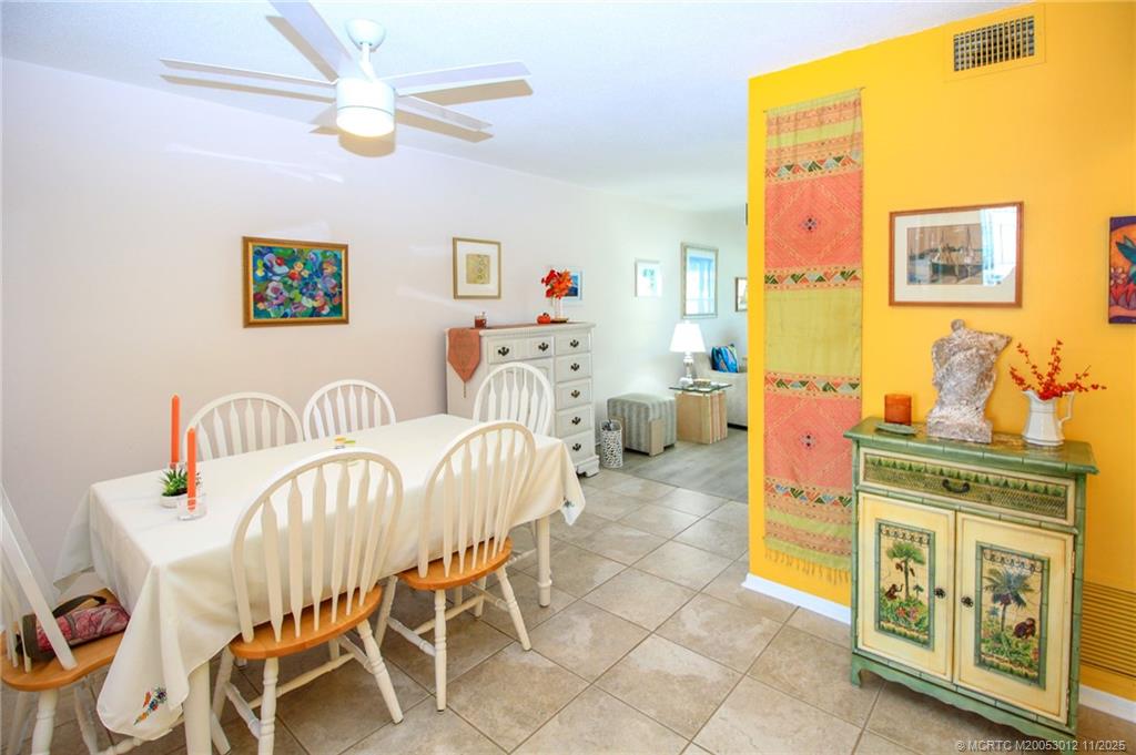 2929 Southeast Ocean Boulevard, Unit 1189 Stuart, FL 34996 - Photo 7 of 34 a view of a dining room with furniture