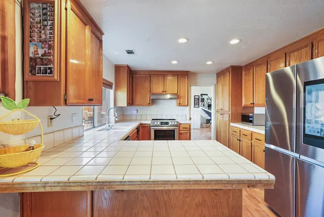 a large kitchen with a large window