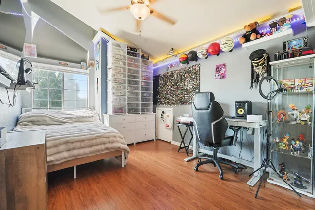 a bedroom with a workspace