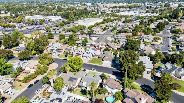 an aerial view of residential houses with outdoor space
