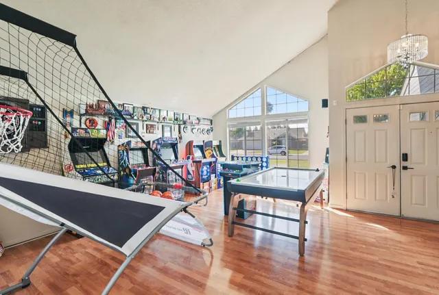 a view of a living room and a wooden floor