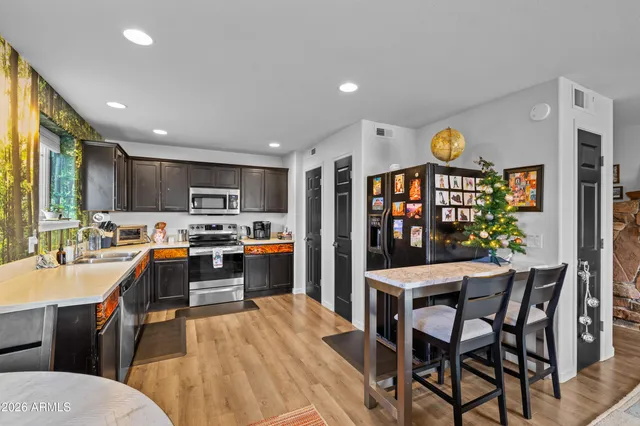 a large kitchen with lots of counter space and stainless steel appliances