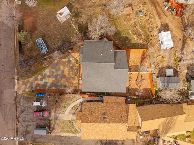 a view of a house with a yard and covered with snow