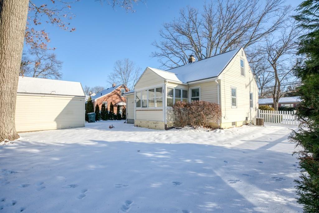 110 Gilman Street Springfield, MA 01118 - Photo 21 of 24 a front view of a house with a yard and garage