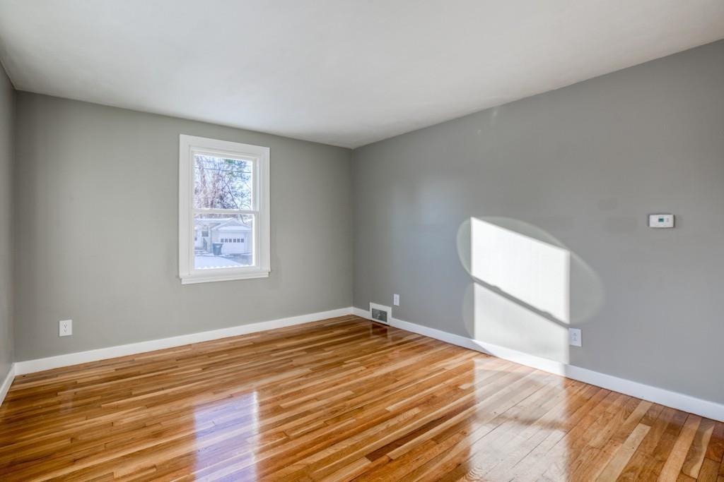 110 Gilman Street Springfield, MA 01118 - Photo 8 of 24 a view of empty room with wooden floor