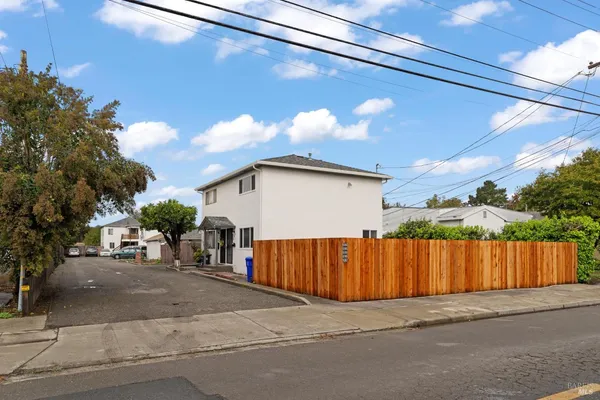 a view of a house with a street
