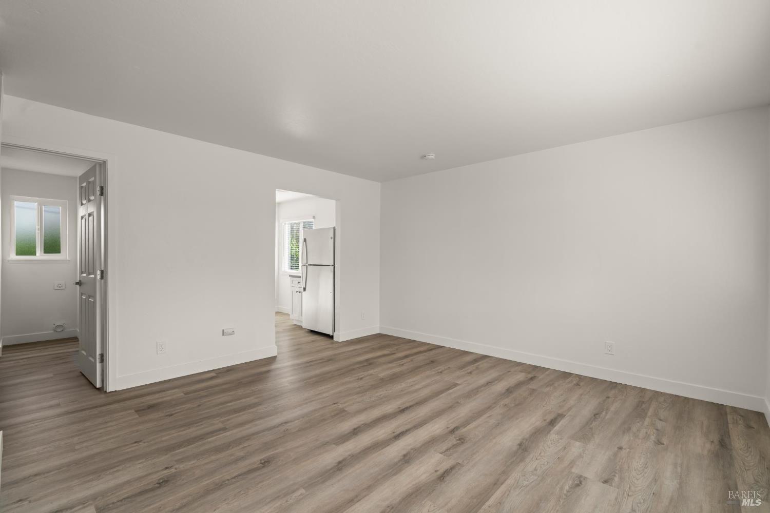 688 Grove Way Hayward, CA 94541 - Photo 20 of 20 a view of an empty room and wooden floor