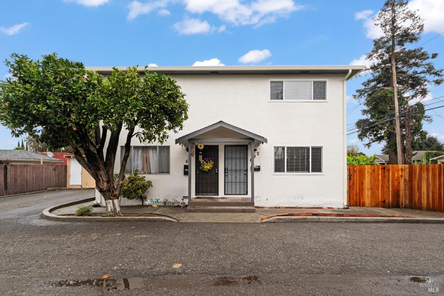 688 Grove Way Hayward, CA 94541 - Photo 2 of 20 a front view of a house with garden