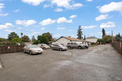 a view of street with parked cars
