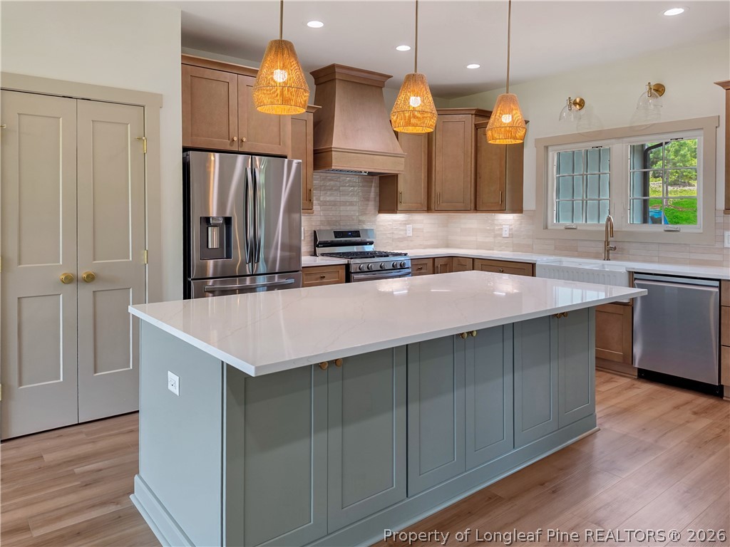900 Niagara Carthage Road Carthage, NC 28327 - Photo 1 of 38 a kitchen with a sink a counter space appliances and cabinets