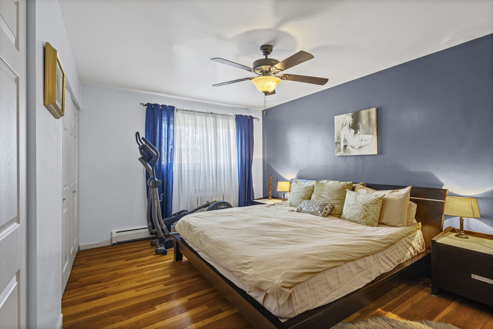 9561 Dee Road, Unit 1D Des Plaines, IL 60016 - Photo 11 of 15 a bedroom with a bed and a chandelier