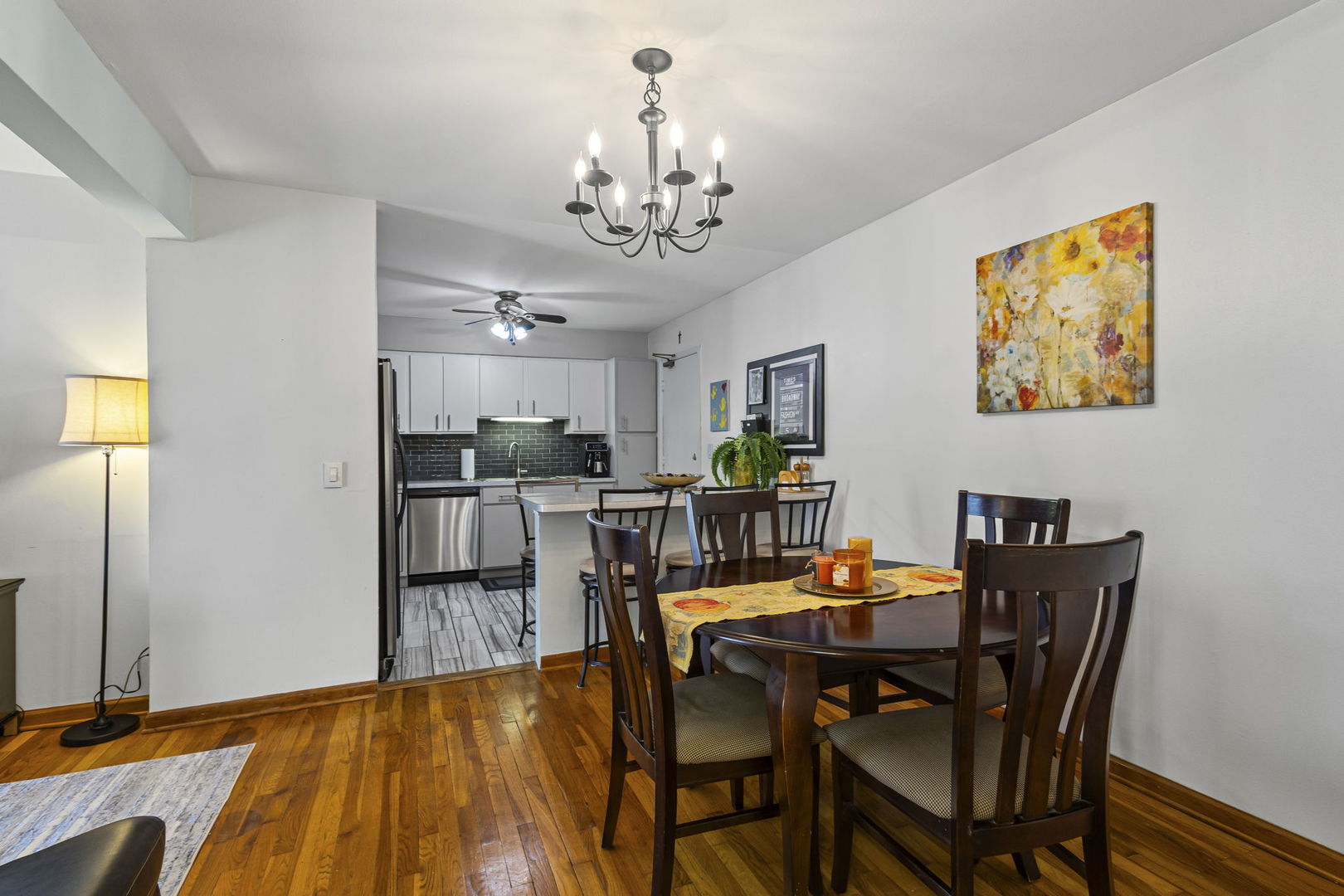 9561 Dee Road, Unit 1D Des Plaines, IL 60016 - Photo 5 of 15 a view of a dining room with furniture and chandelier