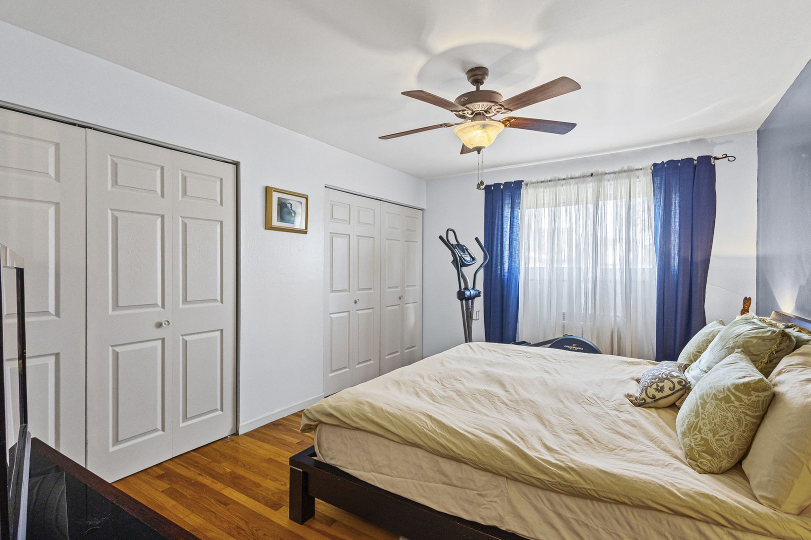 9561 Dee Road, Unit 1D Des Plaines, IL 60016 - Photo 10 of 15 a bedroom with a bed and a chandelier