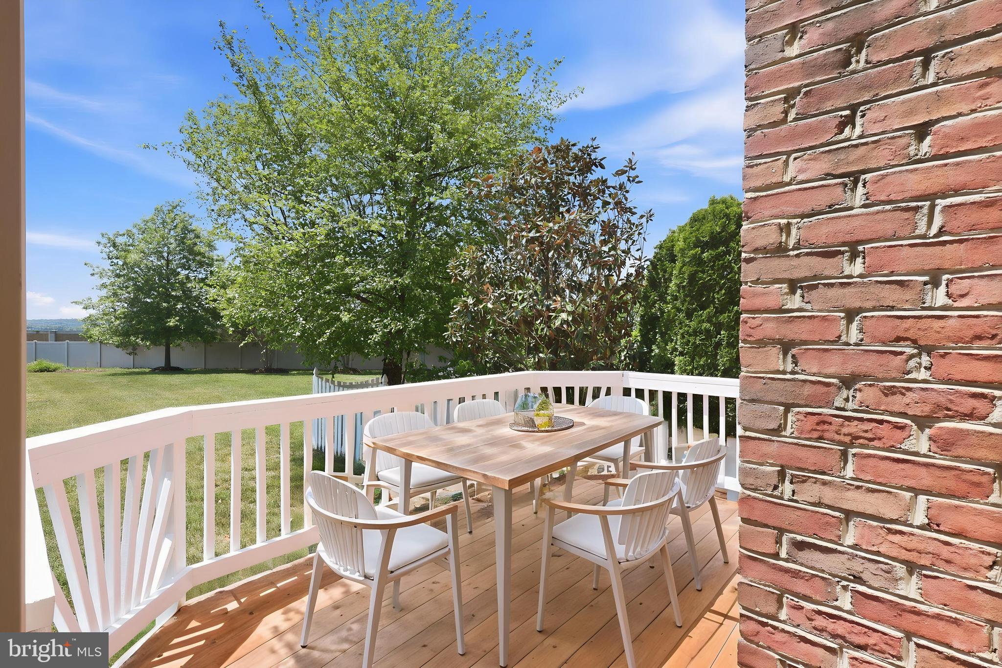 19617 Edgemont Square Ashburn, VA 20147 - Photo 52 of 65 a view of a chairs and table on the deck
