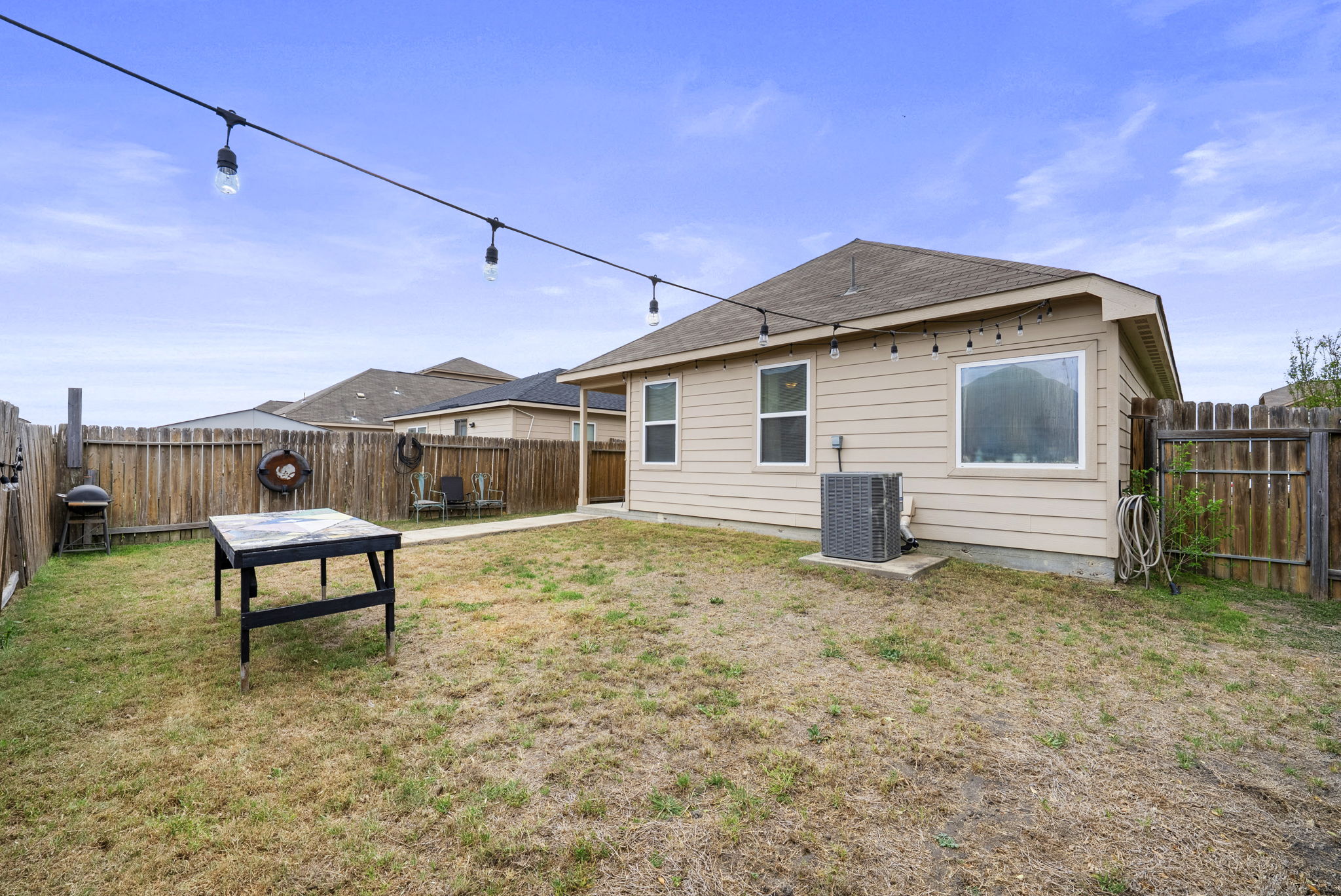 1617 Treeta Trail Kyle, TX 78640 - Photo 5 of 39 Back of property featuring a fenced backyard