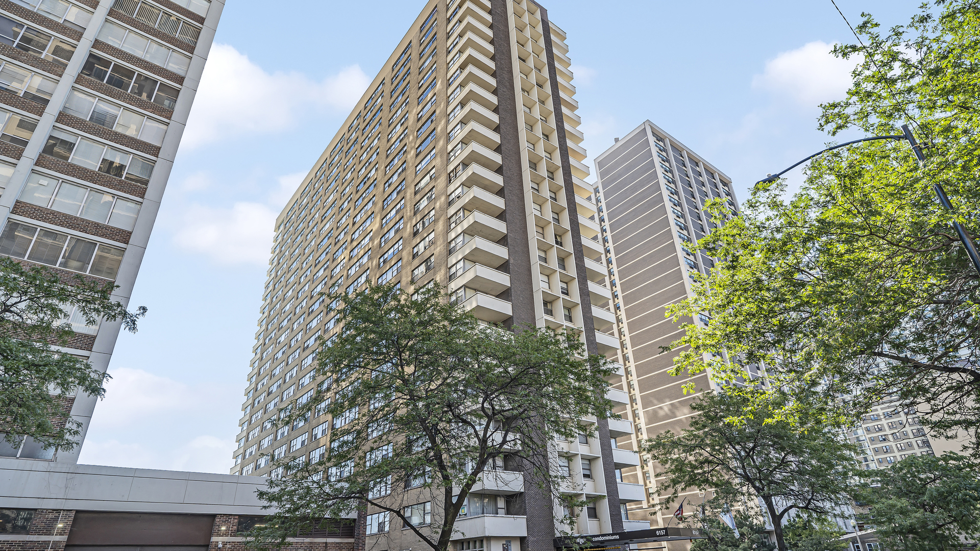 6157 North Sheridan Road, Unit 18K Chicago, IL 60660 - Photo 1 of 14 a view of a tall building