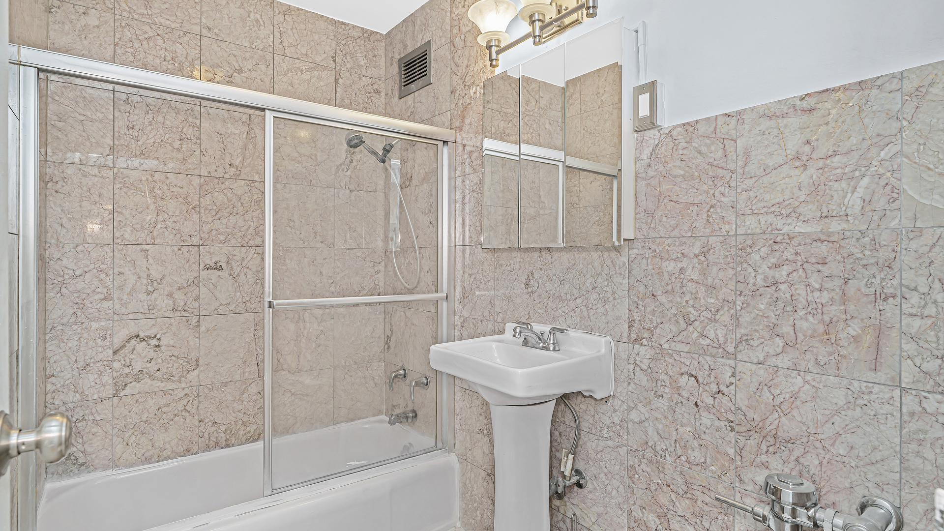6157 North Sheridan Road, Unit 18K Chicago, IL 60660 - Photo 10 of 14 a bathroom with a sink and shower