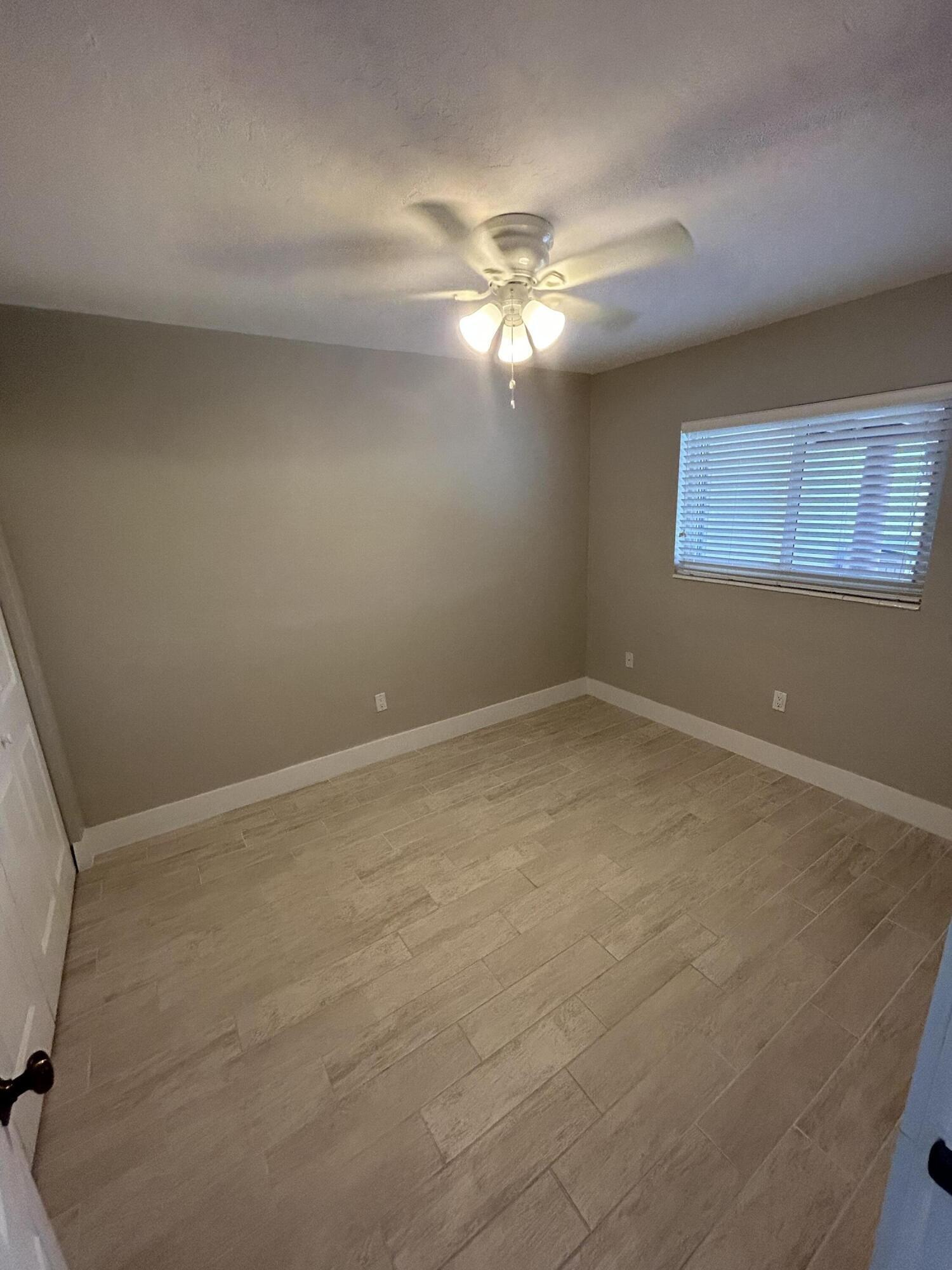 2004 Southwest 131st Place Miami, FL 33175 - Photo 11 of 16 a view of an empty room with a window