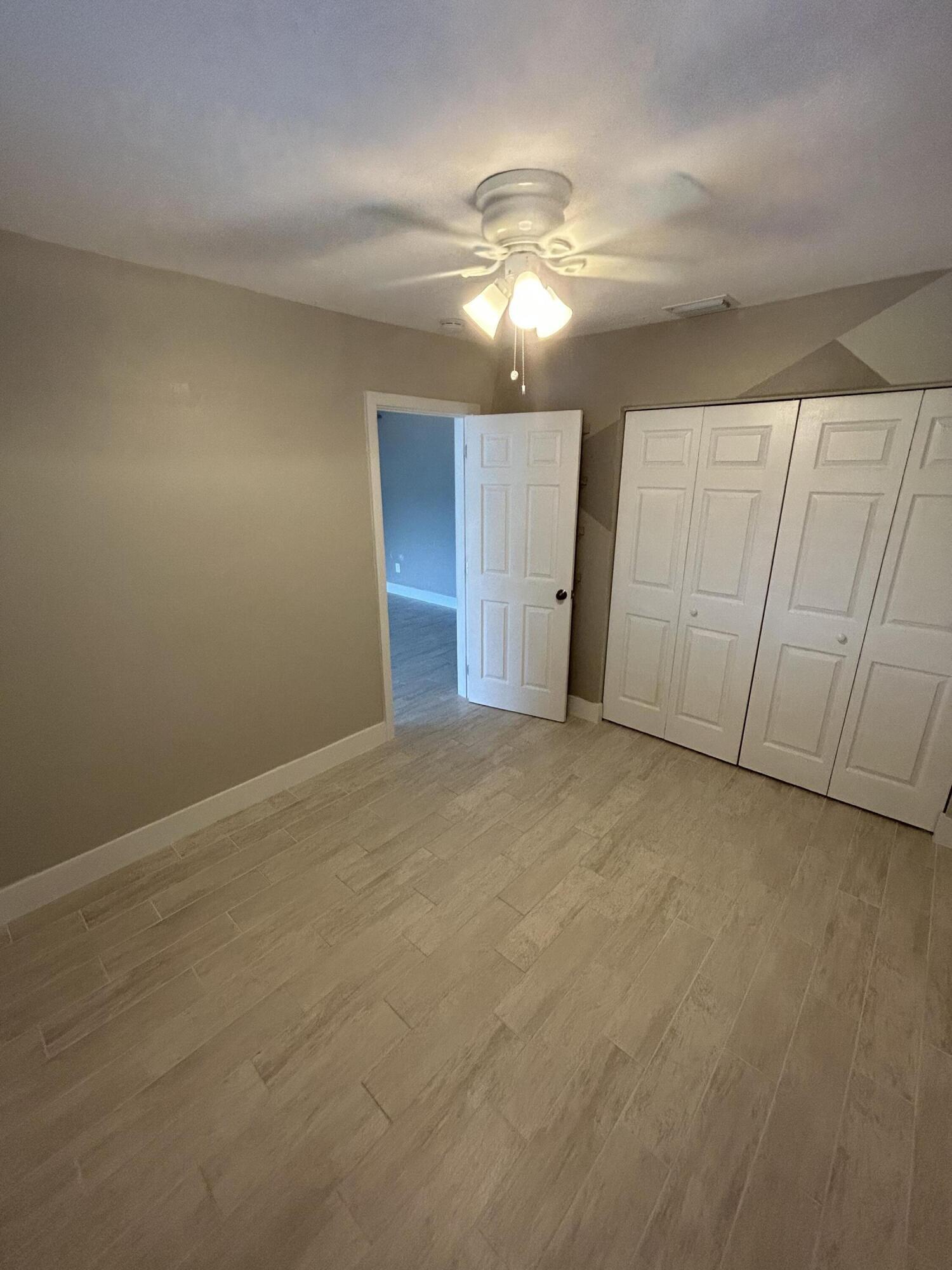 2004 Southwest 131st Place Miami, FL 33175 - Photo 12 of 16 a view of an empty room with a chandelier fan