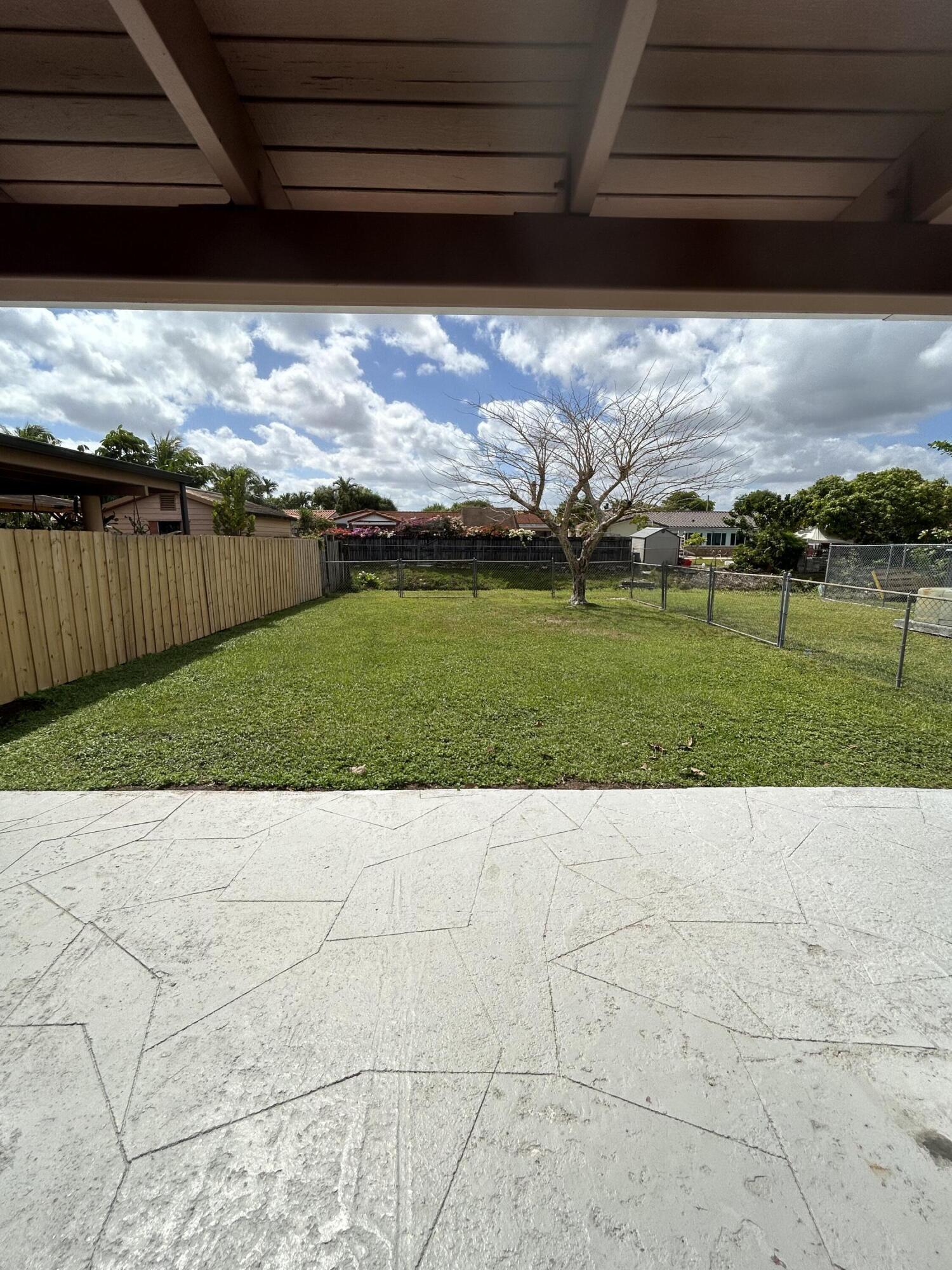 2004 Southwest 131st Place Miami, FL 33175 - Photo 15 of 16 a view of an outdoor space and a yard
